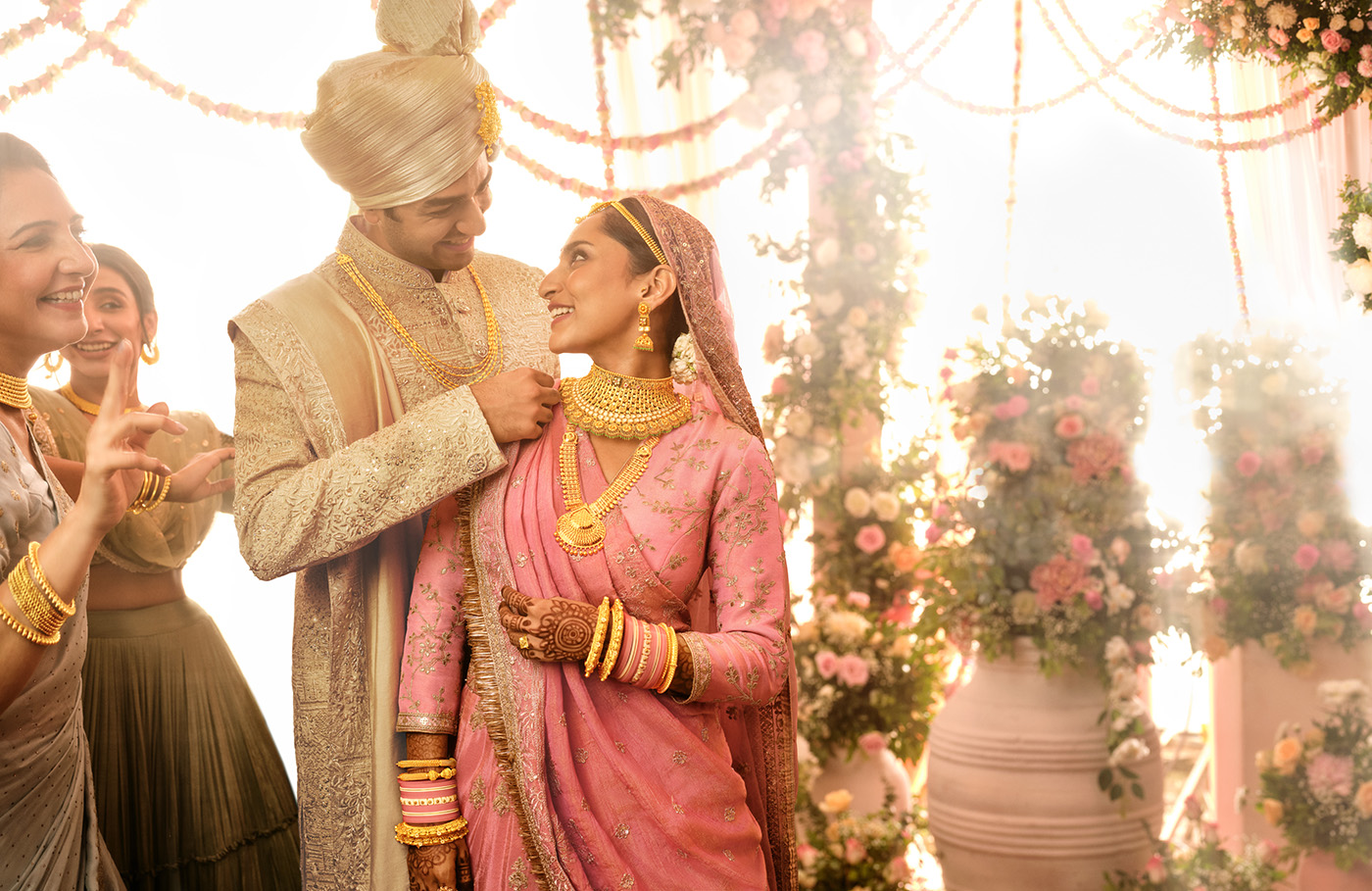 Couple on their wedding day with gold jewellery