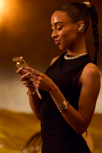 Person using mobile behind text 'How to own gold online'